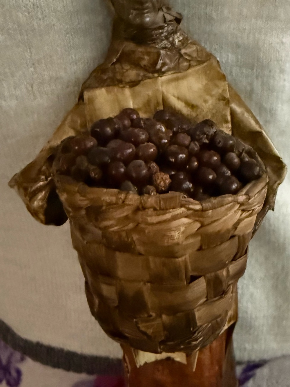 Paper mâché doll Mexican folk art elder peasant woman with basket of grapes.